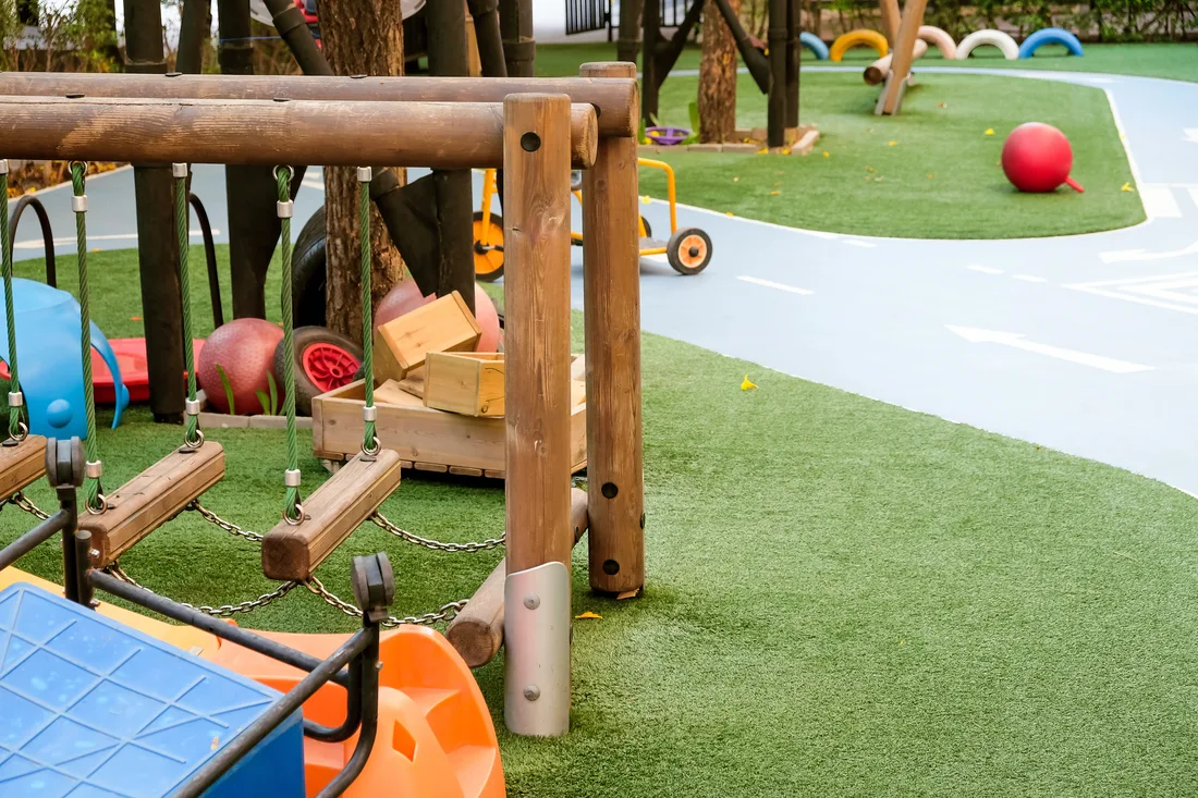 Synthetic turf under play equipment